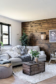 Wall clad in dark wood in rustic living room