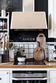 Rustic accessories around hob with modern extractor hood
