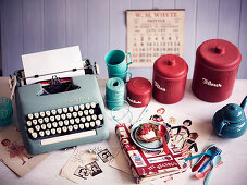Typewriter, kitchen utensils and nostalgic pictures