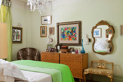 Intricately carved dressing table in bedroom with leopard print chair