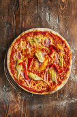 'Sicilia' pizza with peppers, ham and artichokes