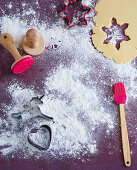 Dough for Christmas biscuits, cutters, stamps and a brush