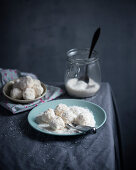 Vegan snowballs (biscuits with soy butter cream and grated coconut)