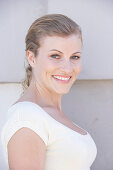 A blonde woman wearing a white shirt