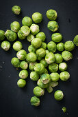 Fresh Brussels sprouts on a black background
