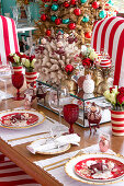 Festively set table decorated in red and white