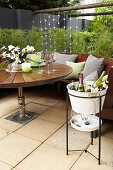 Beverage cooler next to the round garden table on the terrace