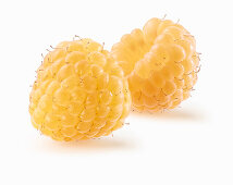 Two yellow raspberries