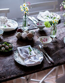 A table laid for Easter with spring flowers and eggs