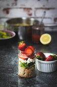 Bulgur salad with green asparagus, feta cheese and strawberries in a jar