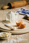 Egg shells, flour, slivered almonds and a rolling pin