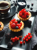 Summer berry tartlets with coffee