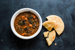 Kale and lentil soup with pita