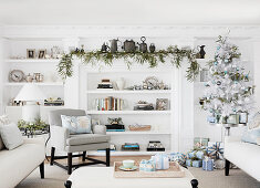 Living room decorated for Christmas with a fir tree and gift boxes