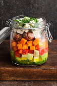 Baked sweet potato salad with meatballs