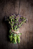 Purple Sprouting Broccoli on Wooden Background