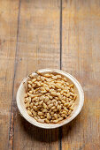 Pine nuts in a wooden bowl