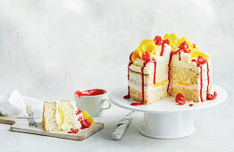 Mango melba cake on a cake stand