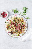 Grain salad with pearl barley, lamb, cauliflower and aubergines