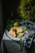 Bundt cake cut into pieces on table