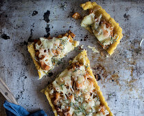 Slice of tart with pumpkin and Emmental cheese placed on tray