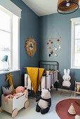 Vintage-style nursery with blue-grey walls