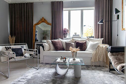 Elegant living room decorated in feminine, glamorous style