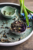 Floral tea with scilla flowers on rustic background