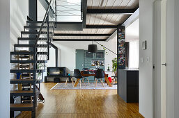 Staircase leading to gallery on steel joists in modern loft apartment