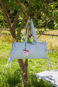 Hand-sewn combination picnic bag and cushion