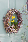 Willow door wreath with daffodil and grape hyacinth