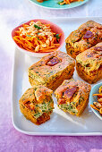 Spicy mini chorizo and spinach cakes and carrot salad with peanuts