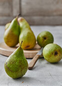 Freshly washed pears with a knife