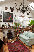 Eclectic living room decorated with curiosities in former factory sales area
