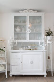 White ornaments on old dresser painted white