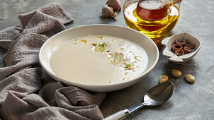 Ajo blanco, spanish typical cold soup, made of almonds and garlic with olive oil and bread