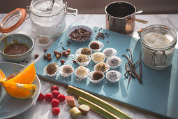 Truffles with hazelnuts, chocolate, coconut, orange, raspberries and salted truffles