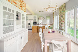 Dining table in open-plan, country-house-style kitchen