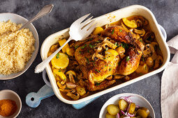 Chicken baked with mushrooms and lemons, couscous