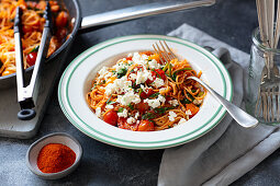 Spaghetti with cherry omatoes, spinach and feta