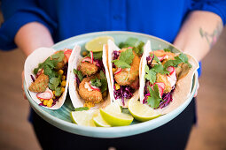 Tacos with fried avocado, red cabbage roasted corn and sriracha mayonnaise