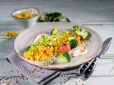 Oriental vegetable and bulgar wheat with broccoli, cherry tomatoes, chervil and rosemary
