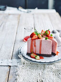 Vegan strawberry brownie cheesecake