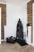 Cast iron stove in corner of rustic room