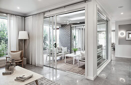 Recessed conservatory in modern house in shades of grey and white