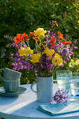 Early summer bouquet of globeflowers, clove root, meadow sage and widow flower