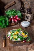 Raw vegetable salad with boiled eggs