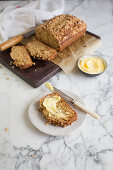 Banana bread, sliced with butter