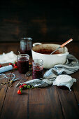Homemade strawberry jam on a rustic wooden table