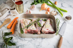 Raw leg of lamb with garlic and herbs